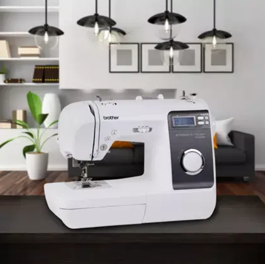 image of the Brother ST150HDH Strong and Tough Computerized Sewing Machine on a table